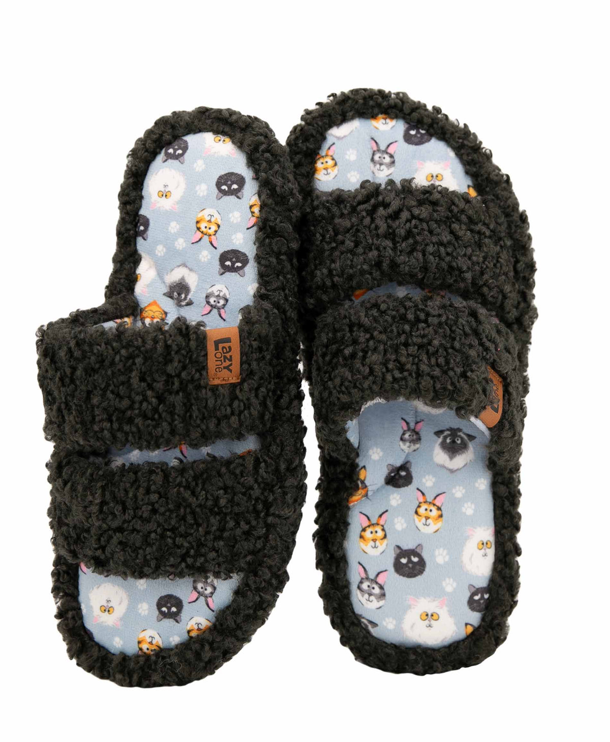 Pair of black fuzzy slippers with patterned soles on a white background